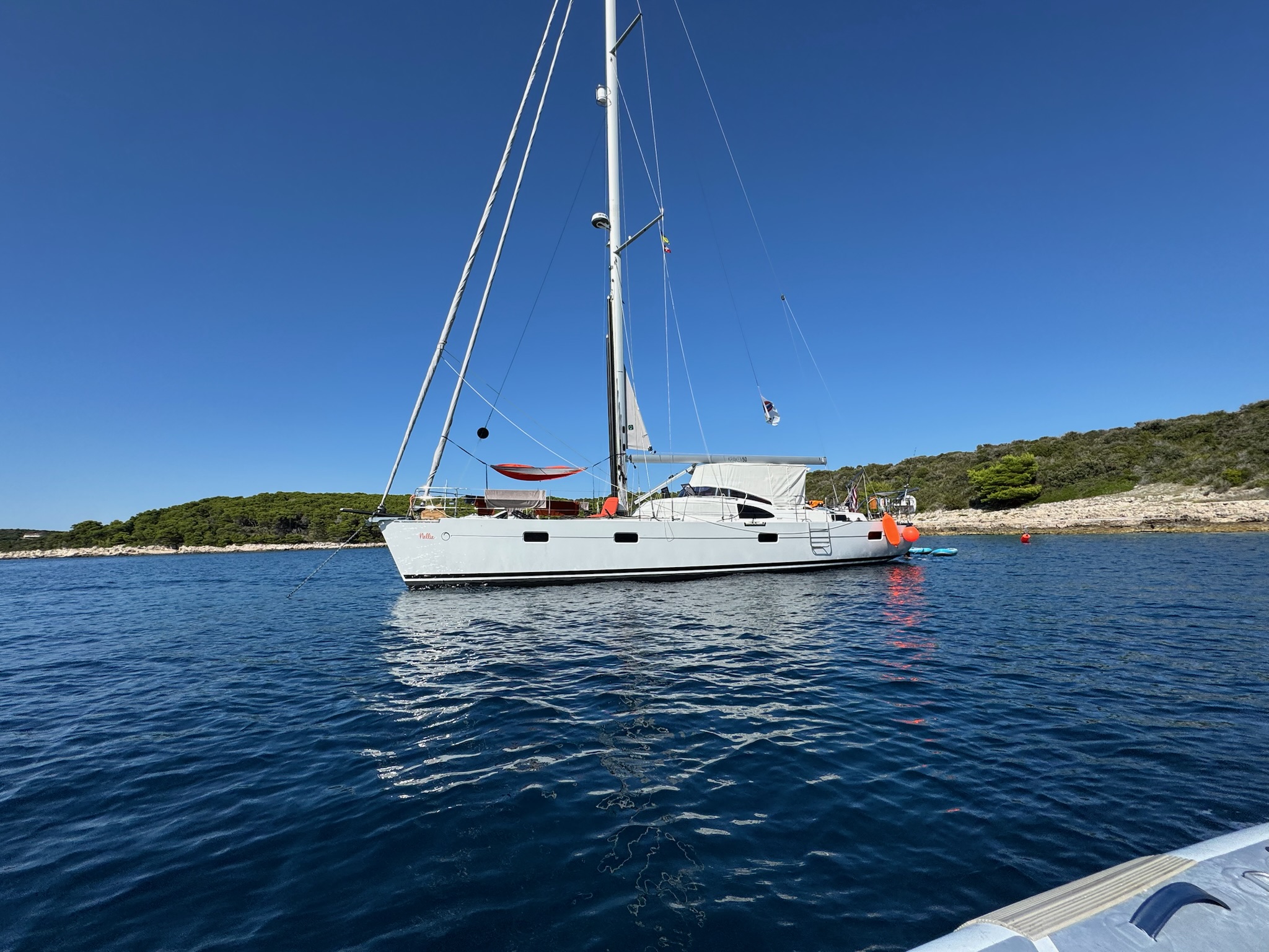 Nellie at anchor in a quiet cove